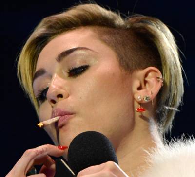 Miley Cyrus Smokes Joint On Stage In Amsterdam